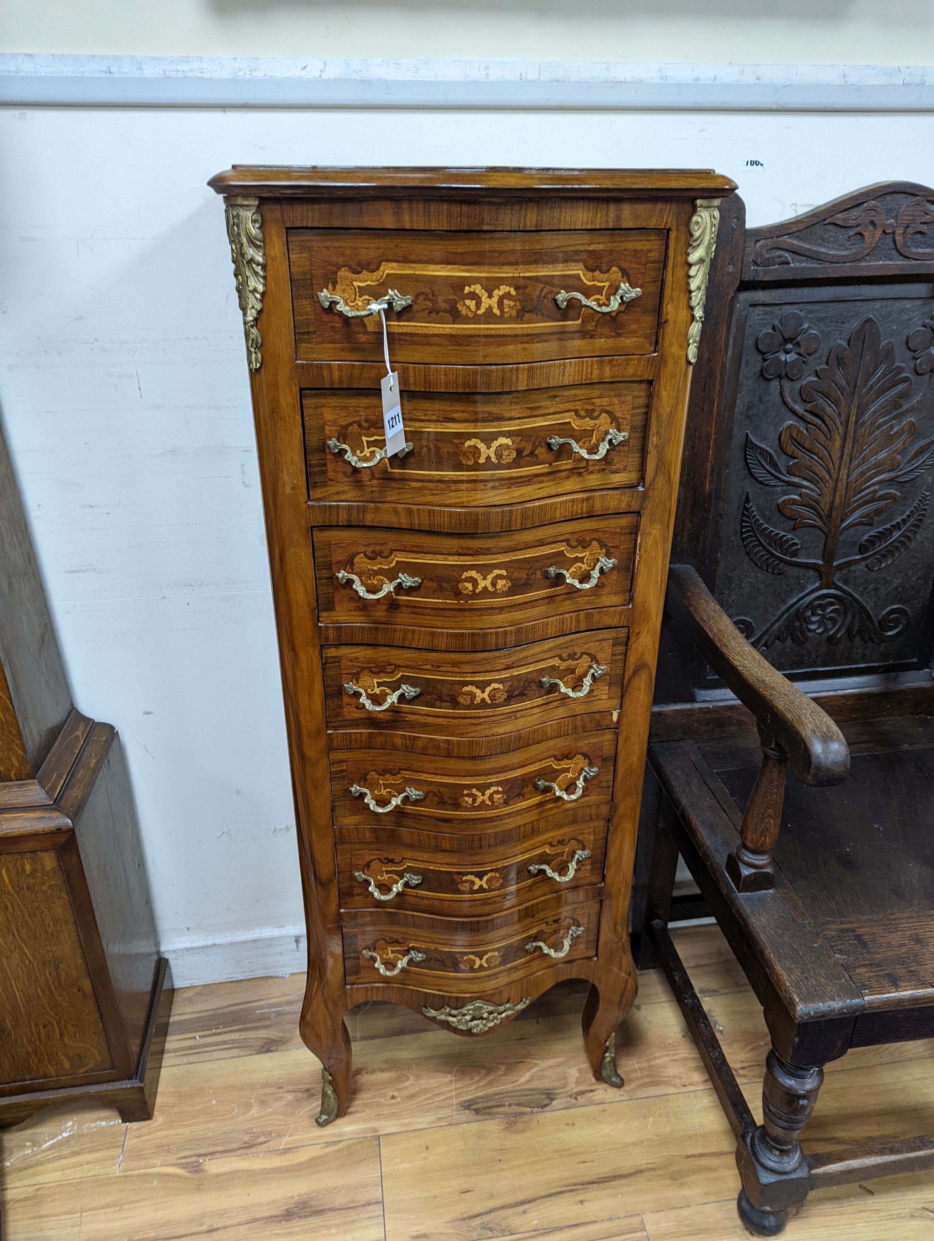 A Louis XV style marquetry inlaid serpentine fronted semanier, fitted seven small drawers, width 47cm, height 122cm